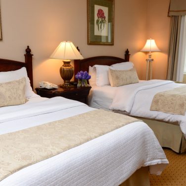 two queen beds in a Nassau Inn hotel room