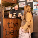 bent spoon worker giving pint to customer