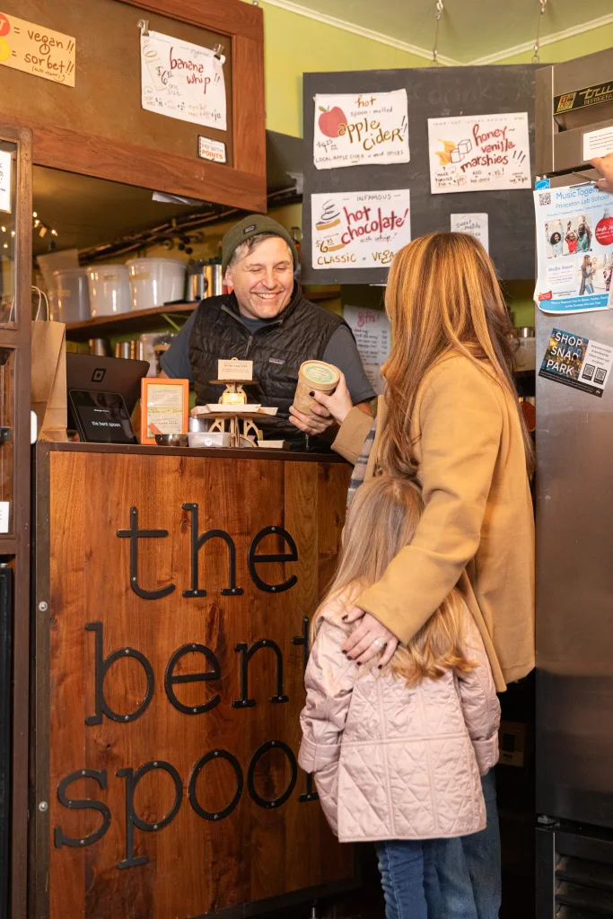 bent spoon worker giving pint to customer