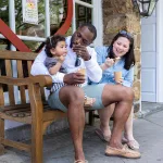 family eating outside bent spoon