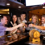 group at winberies bar cheersing