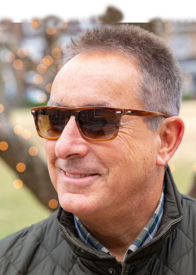 man looking away from camera with sunglasses on