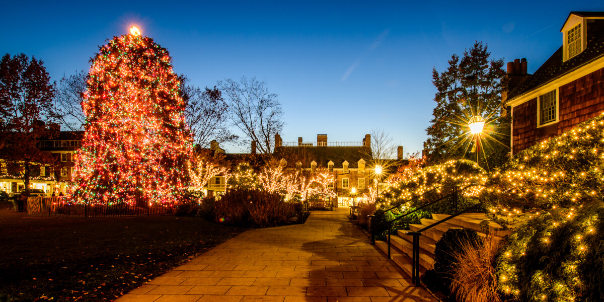 square lit up in holiday lights at dusk