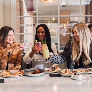 Three ladies enjoying lunch at the bar of Teresa's Caffe