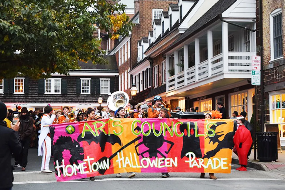 halloween parade marching down Palmer Square West in Palmer Square Princeton, NJ