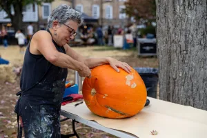 fall fest carving pumpkin
